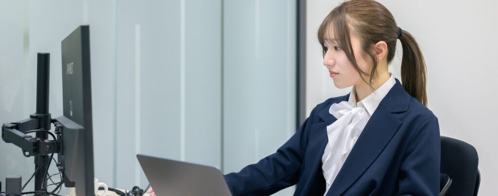 MedSync staff working at a computer